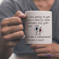 I remembered you're a cunt Dad -  Father's Day Mug held by man in grey t-shirt