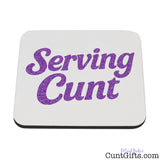 White coaster with purple 'Serving Cunt' text.