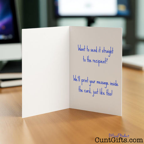 Cunt card opened in workplace showing a personalised message inside with blue writing.