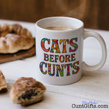 Cats Before Cunts - Mug on table with pastries