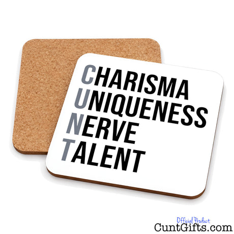 Two square cork subtle cunt drinks coasters on a white background, with one coaster shown from the front in white with bold black text reading 'CHARISMA UNIQUENESS NERVE TALENT' and the other showing the natural cork backing.