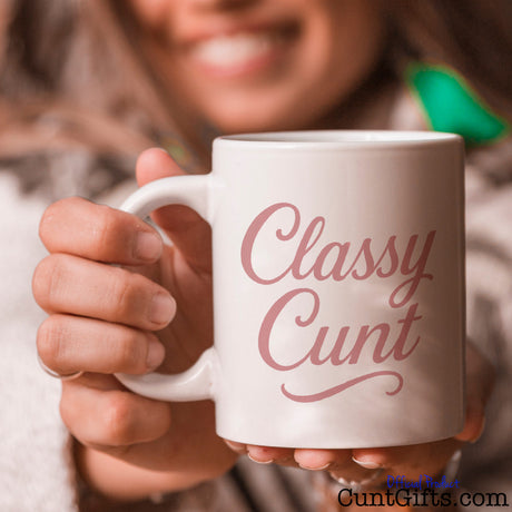 Classy Cunt mug held by smiling woman