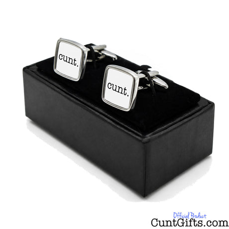 Cunt Cufflinks -  white design in presentation gift box at angle. 