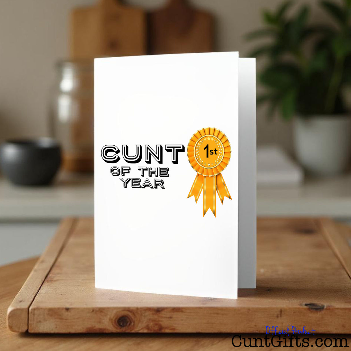 Cunt of the Year Greeting card on a wooden surface
