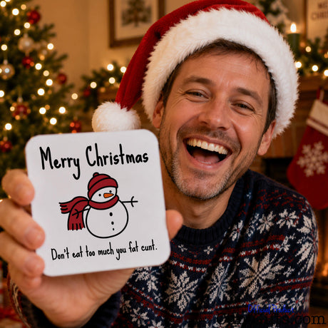 Don't Eat Too Much You Fat Cunt - Christmas drink coaster held by laughing man in festive jumper and Santa hat.