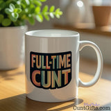 Full-Time Cunt Mug on table with plant