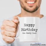 Happy Birthday You Moody Cunt - Mug held by man with stubble