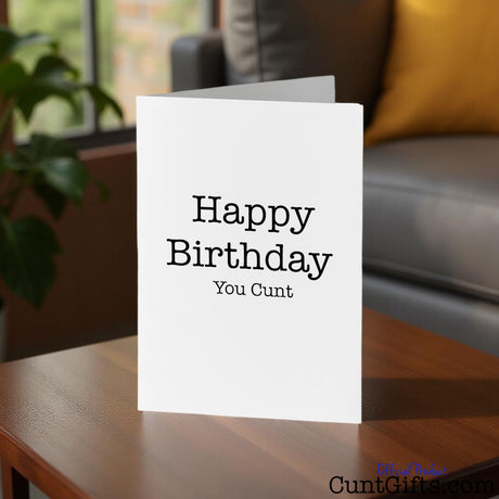 Happy Birthday You Cunt Card on a table in a living room setting