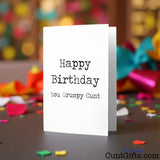 Happy Birthday You Grumpy Cunt birthday card on a party background