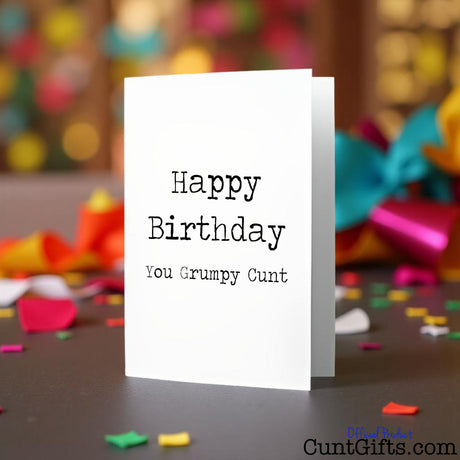 Happy Birthday You Grumpy Cunt birthday card on a party background