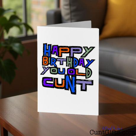 Old Cunt birthday card on a table in a living room setting