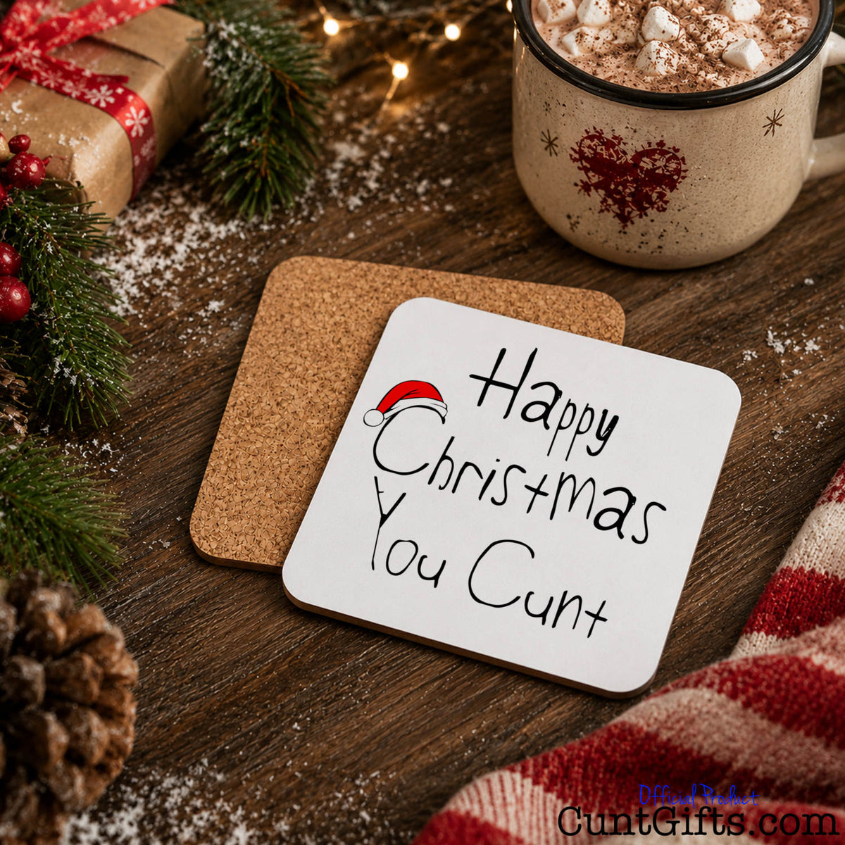 Happy Christmas You Cunt drink coaster showing both sides with cork backing in festive scene with hot chocolate and snow.