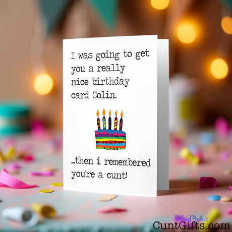 I remembered you're a cunt birthday card with colorful cake illustration and humorous text on a festive background.