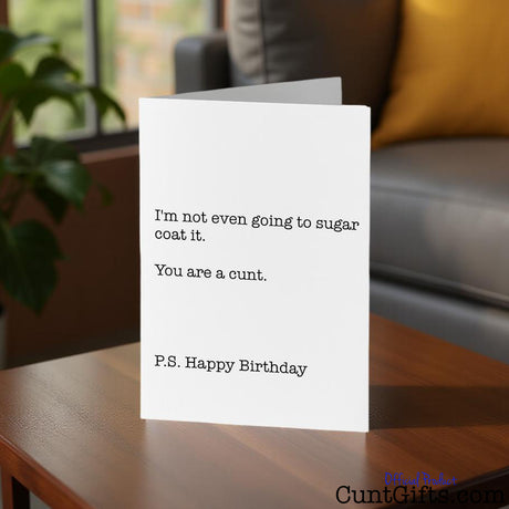 I'm not even going to sugarcoat it birthday cunt card on a table in a home  setting