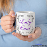Lady cunt mug held by woman in blue jumper