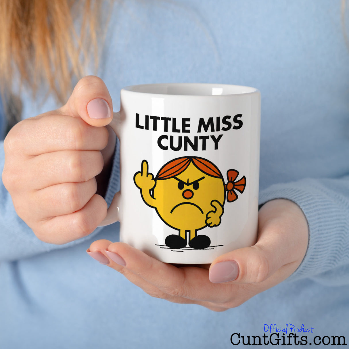 Little Miss Cunty Mug held by woman in blue jumper