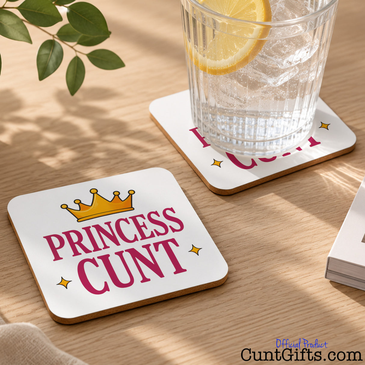 Princess Cunt Drink Coaster on table with water and lemon