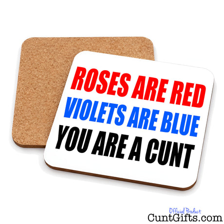 Two square cork coasters on a white background, with one coaster showing the printed front design. The front coaster is white with the text 'ROSES ARE RED VIOLETS ARE BLUE YOU ARE A CUNT' in red, blue, and black lettering.