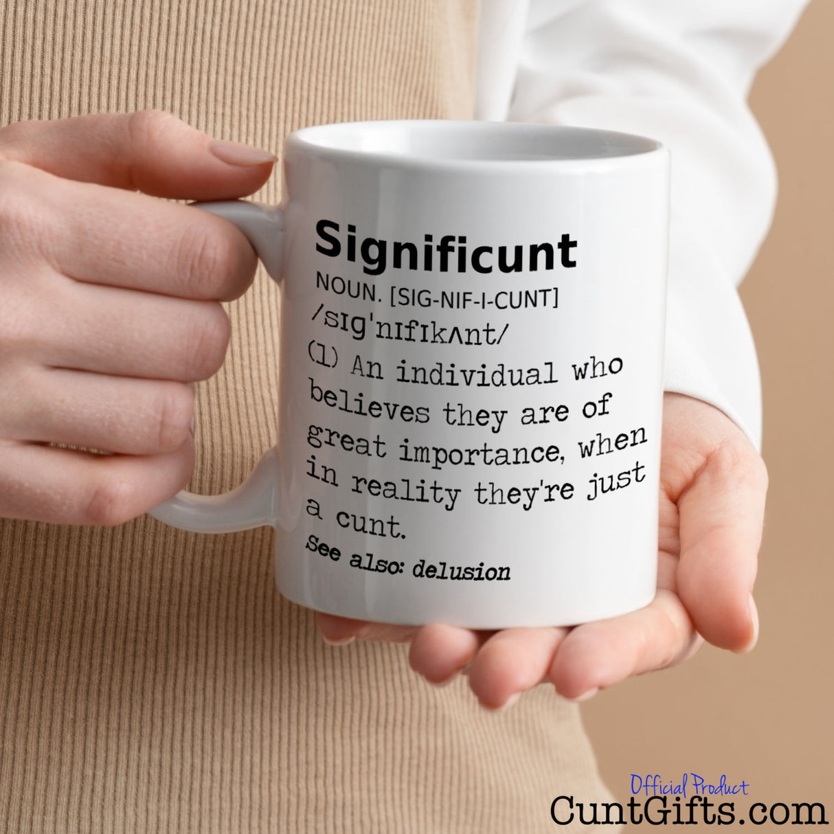 Significunt Mug held in two hands by woman wearing white a beige outfit.
