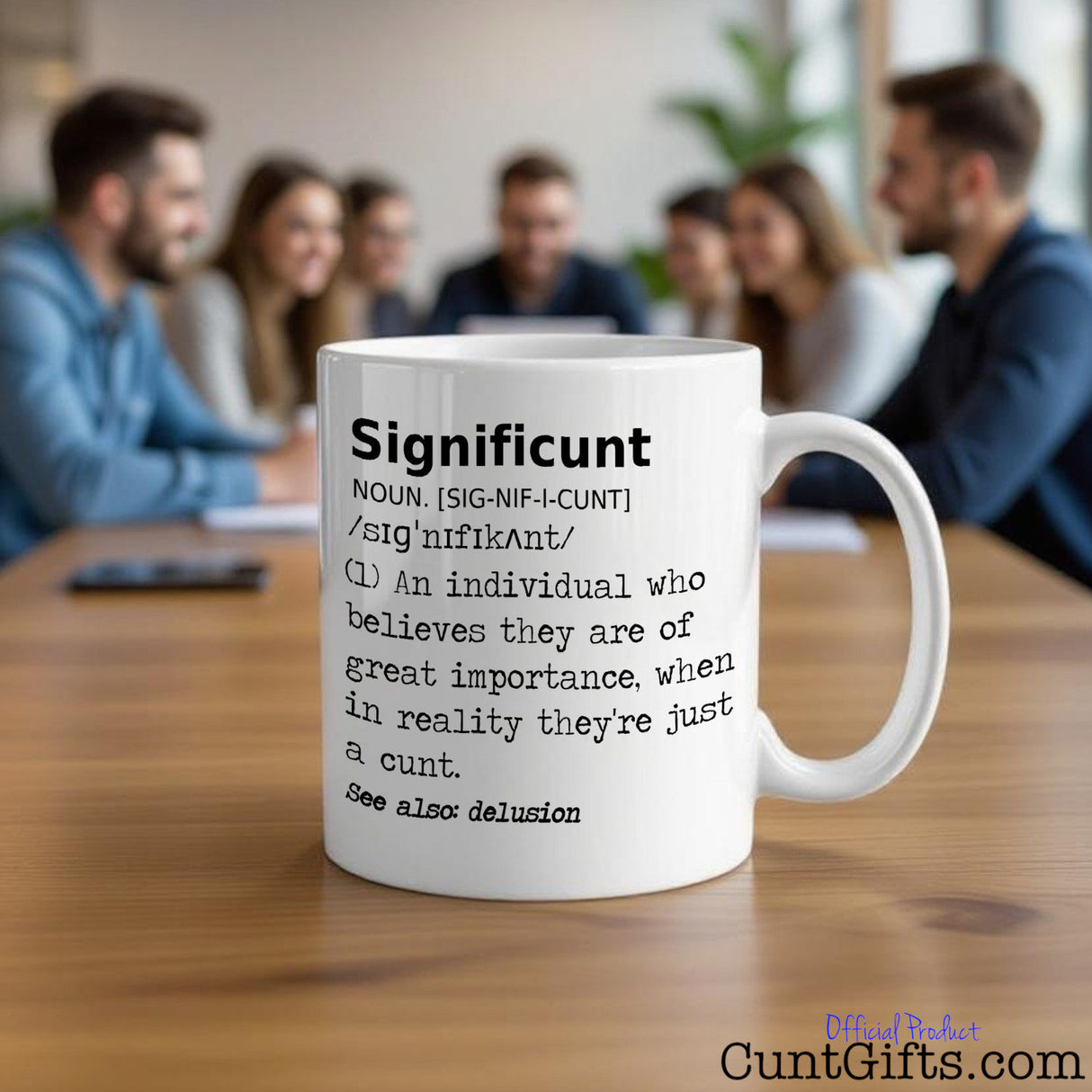 Significunt Mug on table with office workers in the background having a meeting.