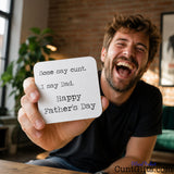 Some say cunt I say Dad - Father's Day Drink Coaster held by laughing man in studio with plant in background.