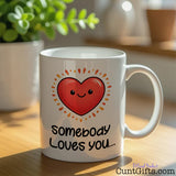 "Somebody Loves You, Not Me, I Think You're a Cunt" -Mug by plant on shelf