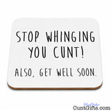 A square white coaster with rounded corners and a brown wood-look edge, printed with the humorous phrase 'STOP WHINGING YOU CUNT! ALSO, GET WELL SOON.' in black handwritten-style text, shown on a white background.