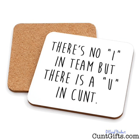 Two square cork coasters on a white background, with one coaster showing a white top printed with the black text 'THERE'S NO "I" IN TEAM BUT THERE IS A "U" IN CUNT.'.