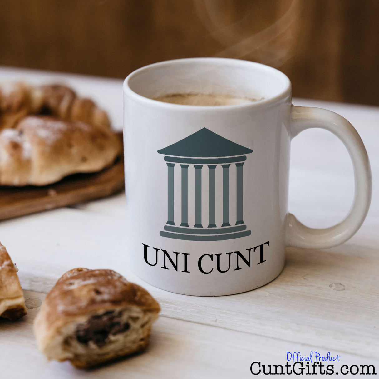 Uni Cunt Mug on table with pastries
