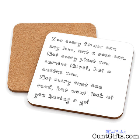 Two square cork "Not every cunt can read" funny drinks coasters on a white background, with one coaster showing a white top printed with a humorous quote in black handwritten-style text.