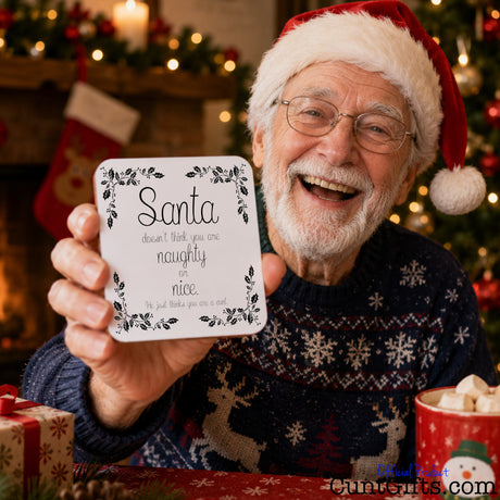 You are not naughty or nice you're a cunt - Christmas Drinks Coaster held by laughing older man in Christmas hat and jumper in festive scene.