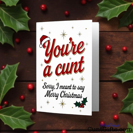 "You’re a cunt. Sorry, I meant to say Merry Christmas"  Card with hollie and berries