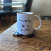 "Anxiety is a cunt" - Mug on table