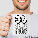 Any Years of Being a Cunt - Mug held by man with smile