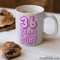 Any Years of Being a Cunt - Pink Birthday mug with coffee and pastries