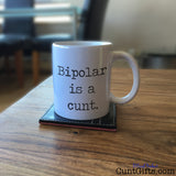 Bipolar is a cunt - Mug on Table