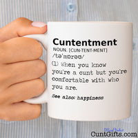 Cuntentment - Mug held by woman in striped blouse