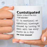 Cuntstipated - Mug held by woman in small striped shirt