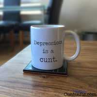 Depression is a cunt - Mug on Table