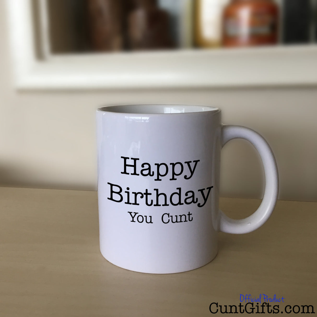 Happy Birthday You Cunt - Mug on Sideboard