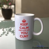 Keep Calm and Fuck Off You Cunt Mug on Glass Table