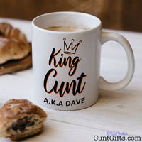 King Cunt Mug with coffee and pastries