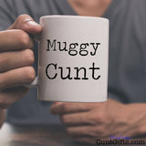 Muggy Cunt - Mug held by man with grey tee