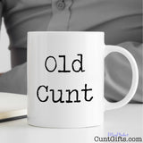 Old Cunt - Mug on desk with man writing notes