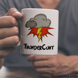ThunderCunt Mug being held by man in grey t-shirt