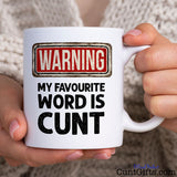 Warning my favourite word is cunt - Mug being held by woman in knitted jumper